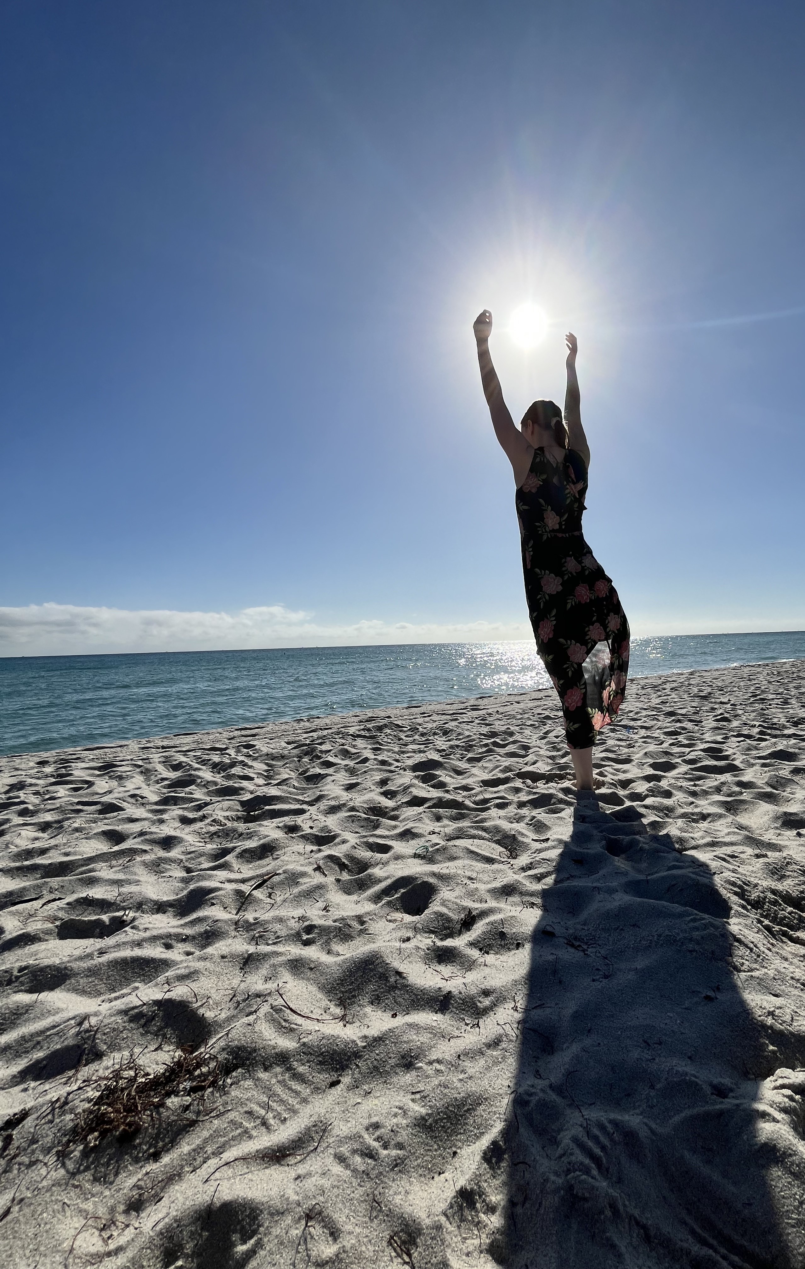 Zoe doing beach yoga